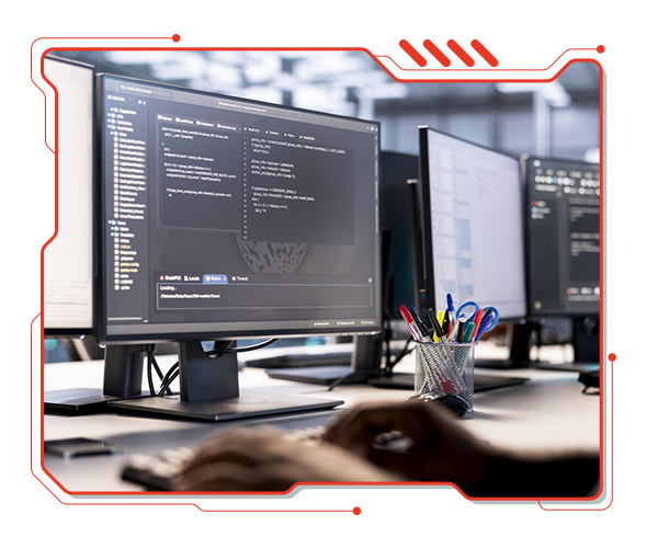 Pic of a Software Engineer looking and typing computer code